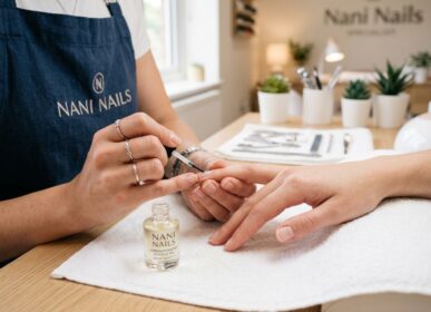 Manicurist applying cuticle 202604281410